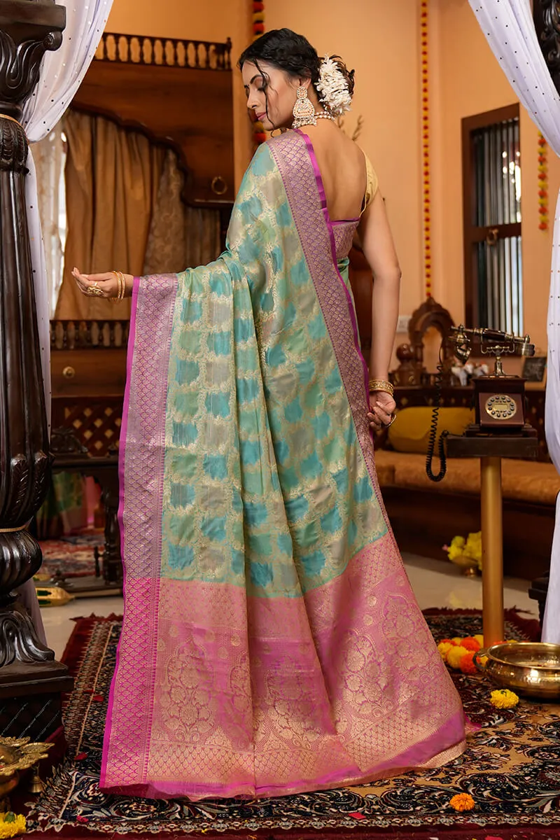 Cynosure Firozi Organza Silk Saree With Demesne Blouse Piece