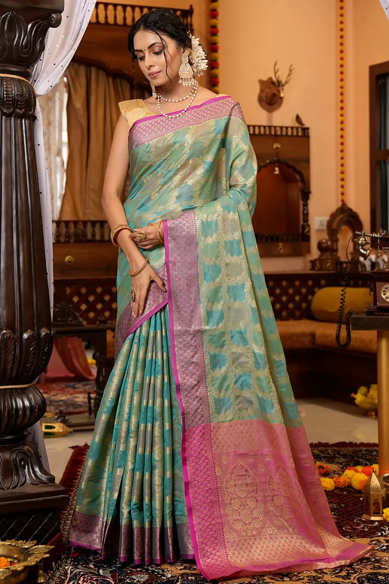 Cynosure Firozi Organza Silk Saree With Demesne Blouse Piece