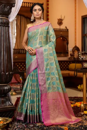Cynosure Firozi Organza Silk Saree With Demesne Blouse Piece